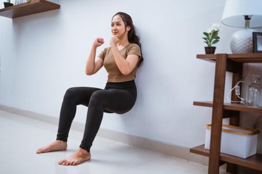 A person doing a wall sit