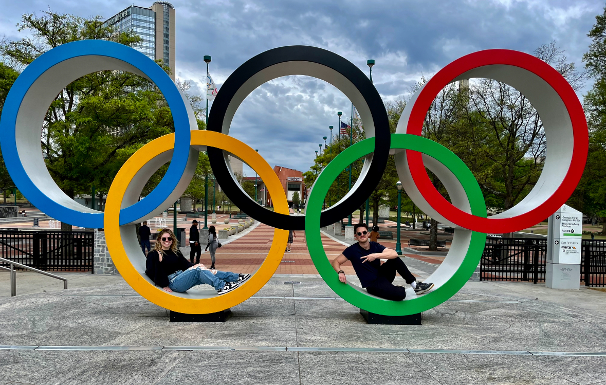 Two people sit in the Olympic Rings in Atlanta.