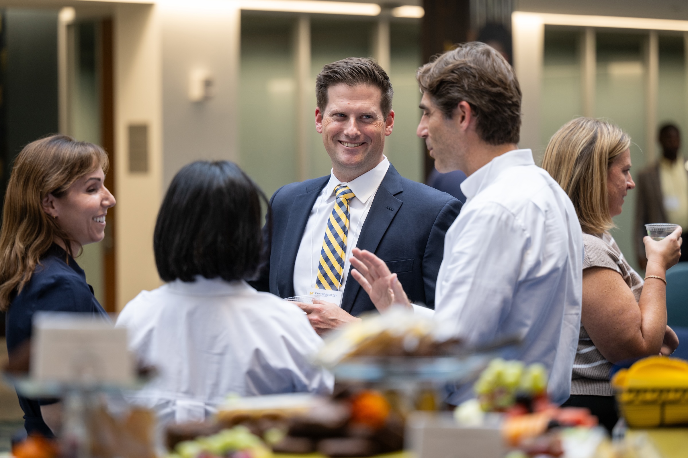 New sport management program chair Brian McCullough chats with attendees at this year's Homecoming mixer.