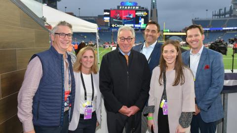 Members of the UnitedHealth Group sponsorships team before a Patriots game with famed ESPN reporter Sal Paolantonio 